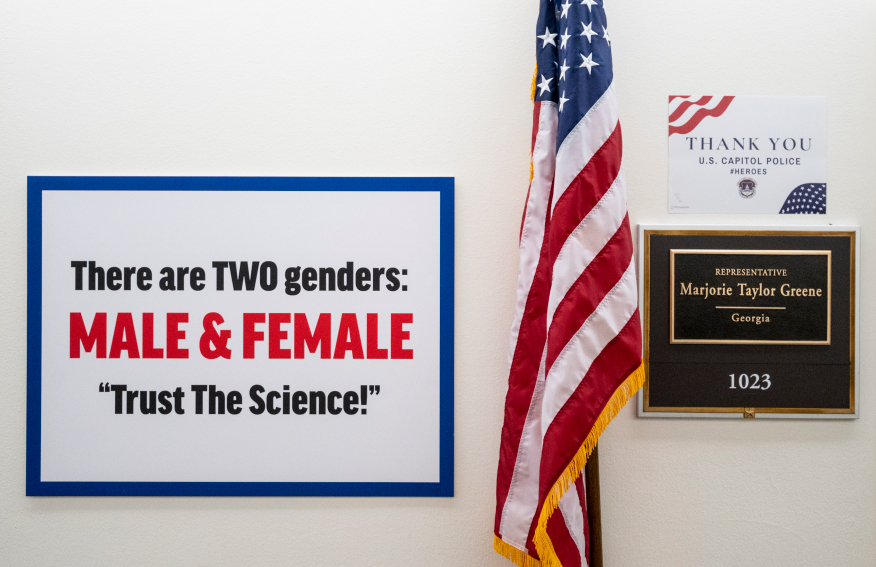 A sign outside of Representative Marjorie Taylor Greene of Georgie's office that reads "there are TWO genders: MALE & FEMALE 'Trust The Science!'"