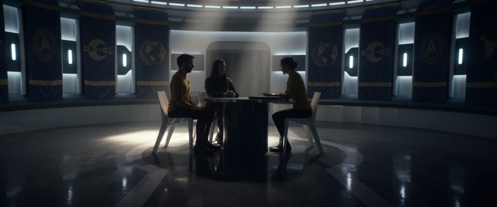 Una talking with Captain Batel in a dark room