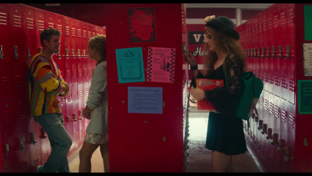 Lisa putting the combination to her locker into the lock.