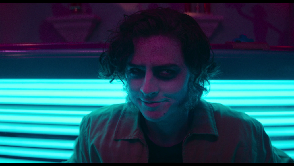 A very human looking Frank sitting on the edge of the tanning bed.