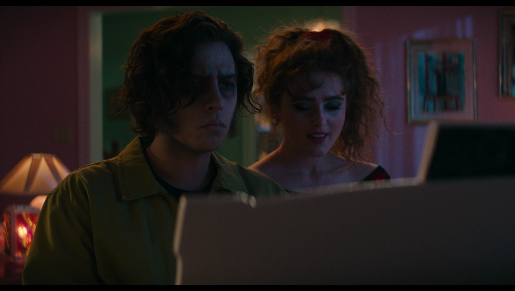 Frank and Lisa sit next to each other at a piano.