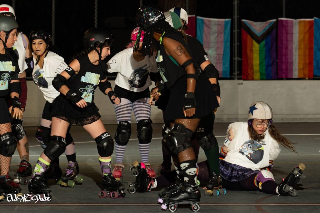 me jamming in a derby bout after being knocked to the ground by a blocker