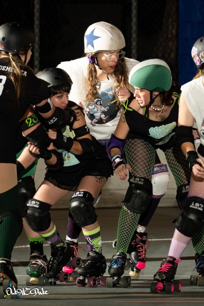 me jamming in a derby bout with two blockers in front of me