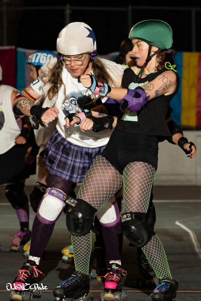 me jamming and colliding with a blocker in a derby bout
