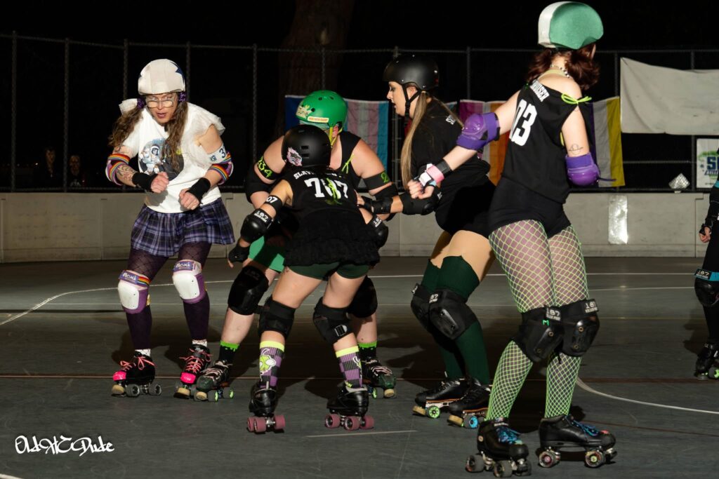 me jamming in a derby bout and looking at all four of the other team's blockers who are about to converge on me