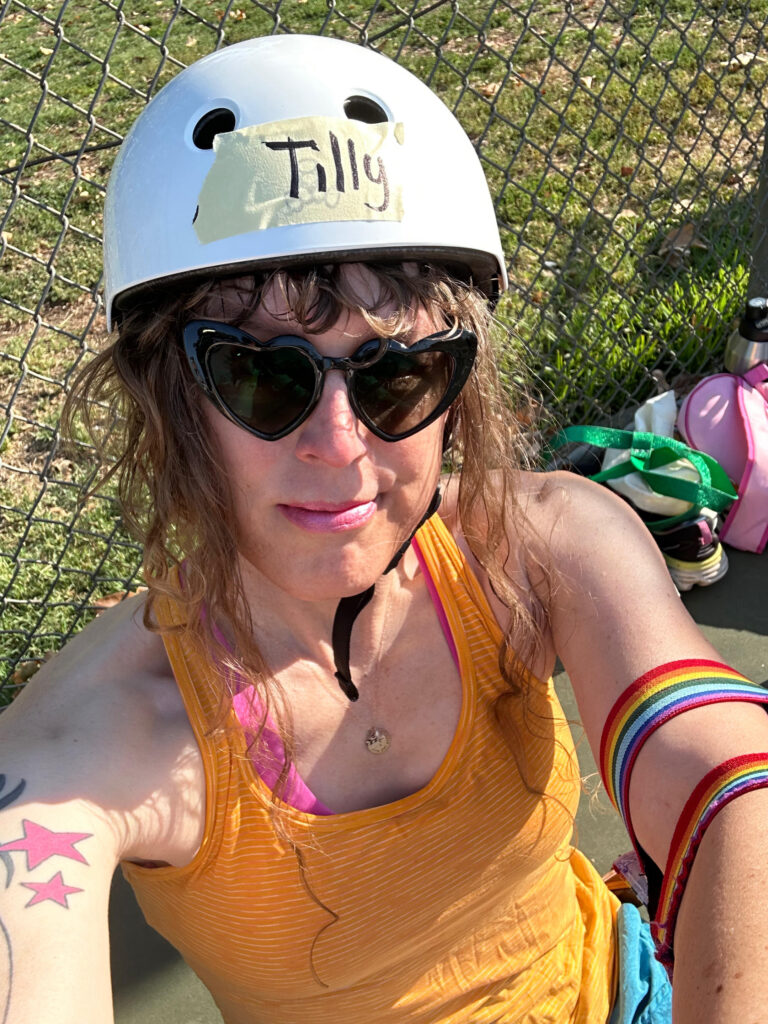 me in a white derby helmet with TILLY written on tape on the front of it