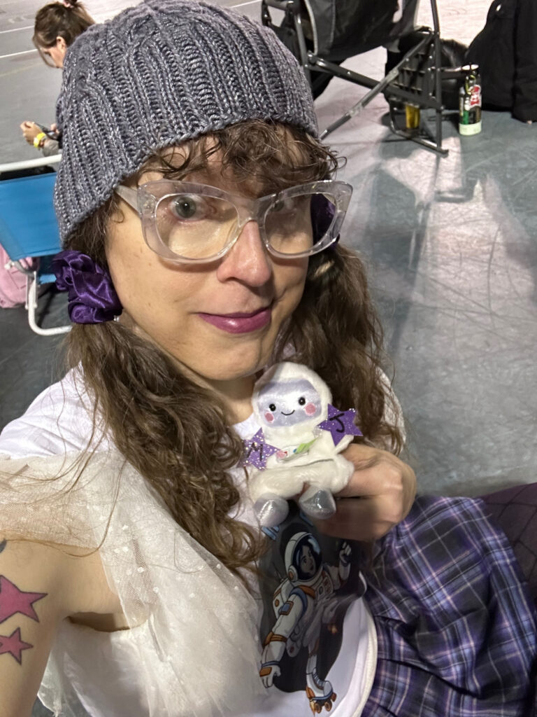 me holding my ssmall stuffed astronaut MVJ trophy