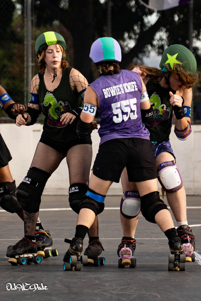 me taking a shoulder hit so hard that my pigtails are whipping around to slap me in the face