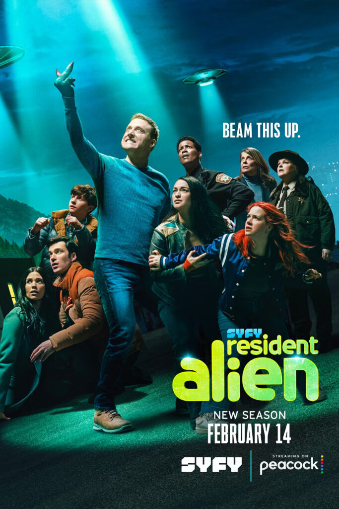 resident alien promo poster showring the cast gathered around Harry, all looking at flying saucers in the sky, as Harry gives the saucers the middle finger