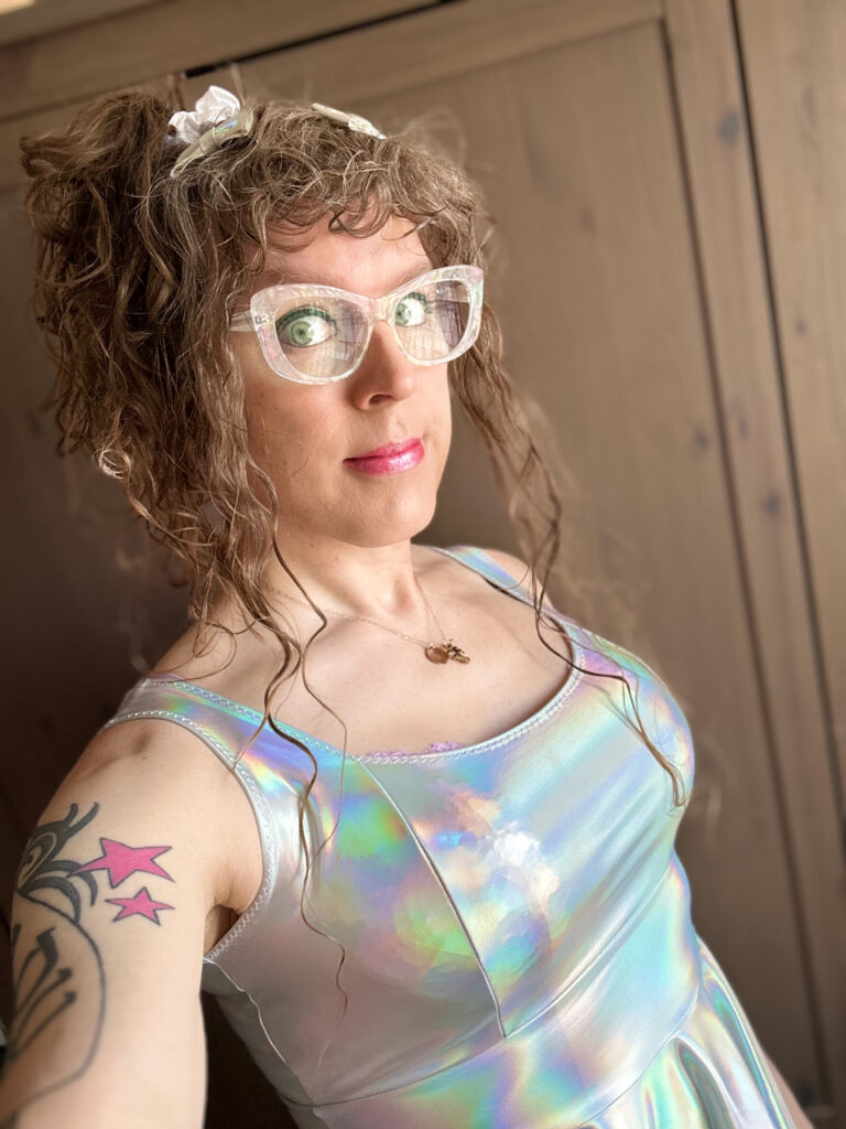 Me in a holographic shimmery dress with holographic shimmery bows in my hair