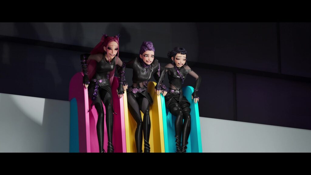 Mira, Rumi, and Zoey in their black leather outfits, at the top of slides