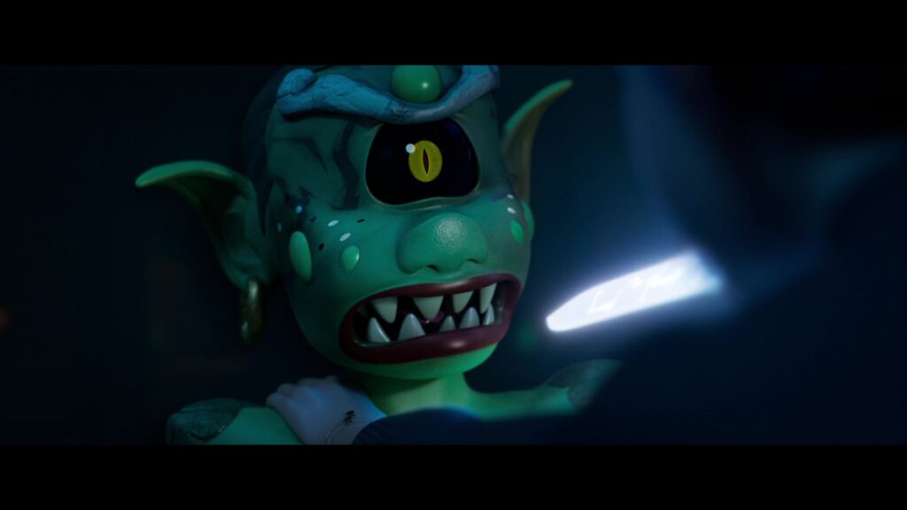 a scared demon looking at the glowing tip of Rumi's magic sword