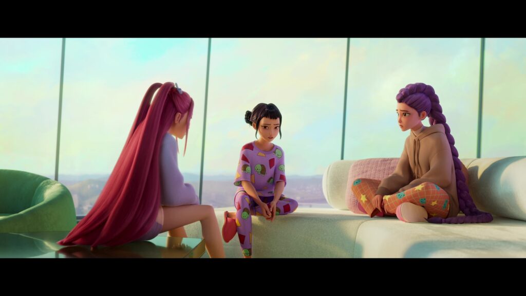 Mira, Zoey, and Rumi sitting in their pajamas and talking