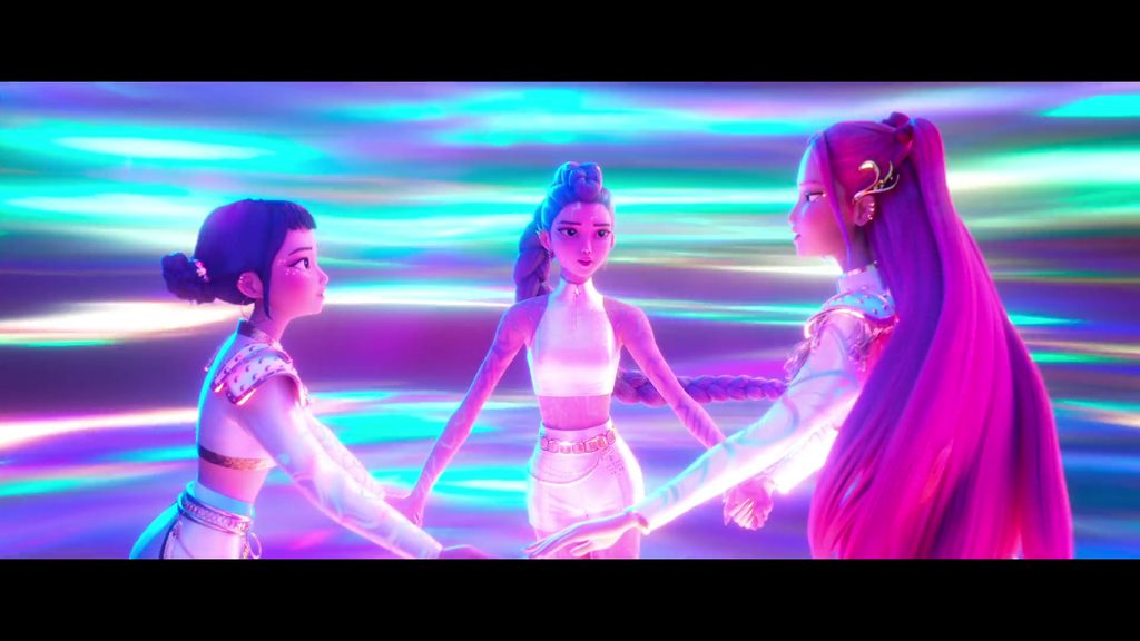 Zoey, Rumi, and Mira holding hands in a circle and multicolored energy swirls around them